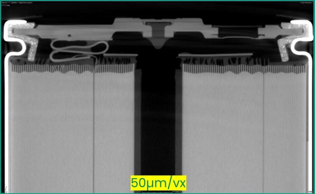 46系圆柱电池X射线断层图像,分辨率50微米,展示极片折叠与焊接区域细节。